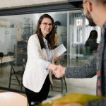 Openly greeting a job recruiter with a firm handshake