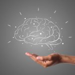 brain writes with white chalk is on hand, draw concept